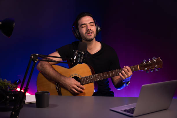 istock Influencer creative audio on live streaming with sing with play guitar. Surmise. 2159692891