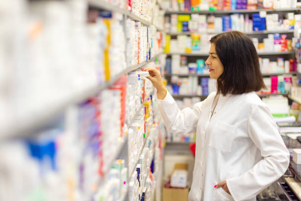 istock Young Caucasian female pharmacist working at the pharmacy 2159693221