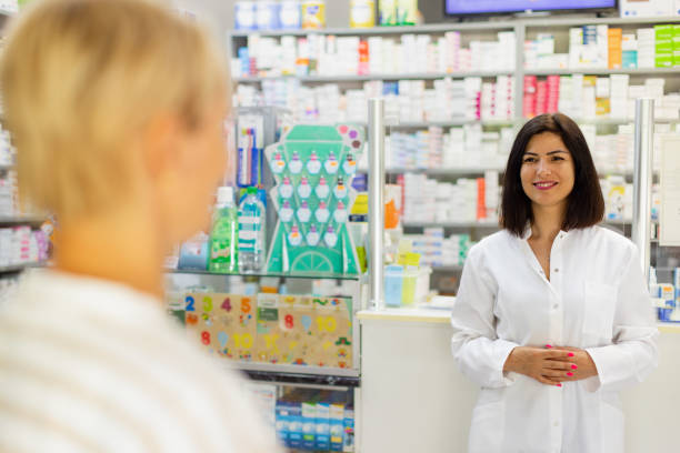 istock Female Caucasian pharmacist and customer at the pharmacy 2159693523