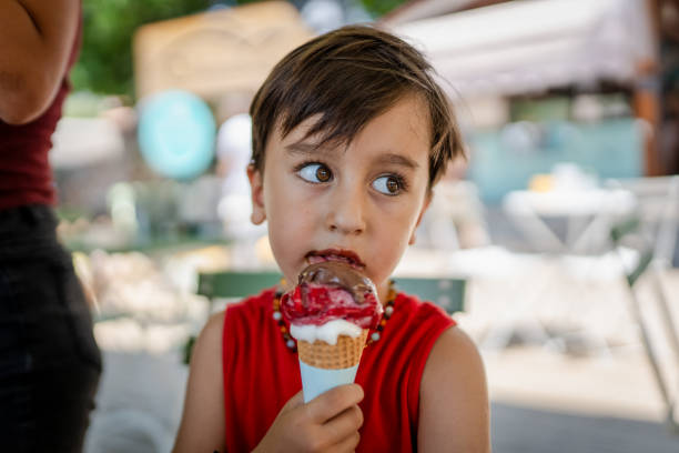 istock Cute Toddler Boy enjoy eating his ice cream 2159693643