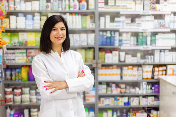 istock Young Caucasian female pharmacist working at the pharmacy 2159693884