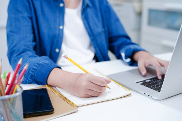 istock Teenage using smart phone for communication, search data internet website to learn. 2159696464