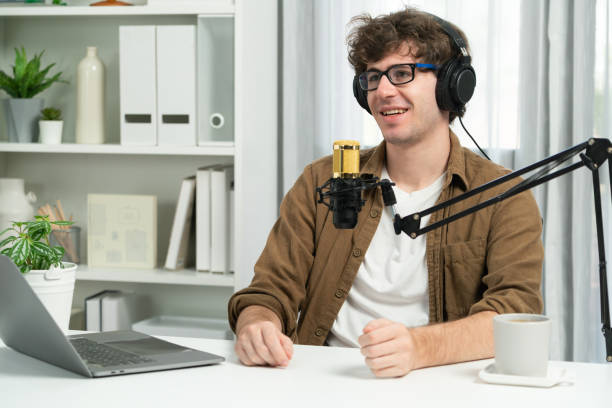 istock Influencer using headphone talking with listeners on social media. Gusher. 2159697288