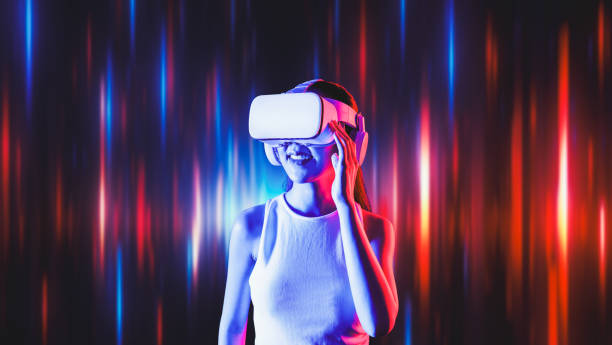 istock Elegant female connecting metaverse looking faraway and smiling. Hallucination. 2159697485