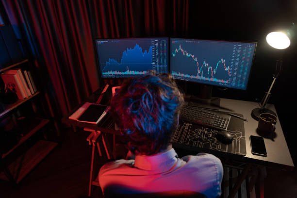 istock Working young business trader focusing stock graph with back side view. Gusher. 2159697711
