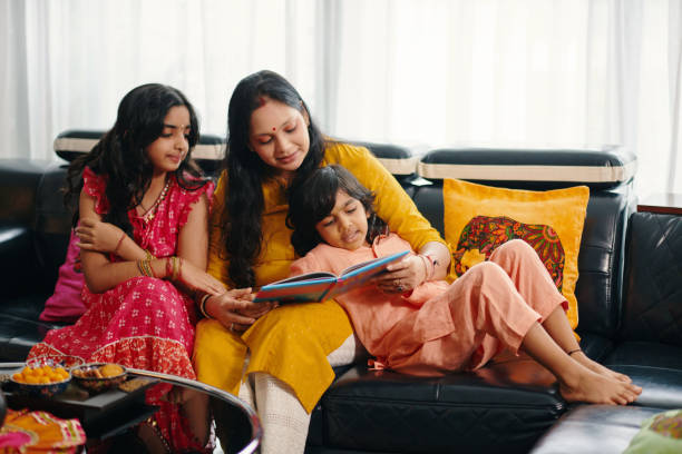 istock Mother Reading Book To Her Children At Home 2159699062