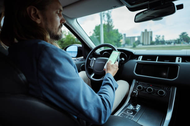 istock Handsome man driving in the city 2159699383