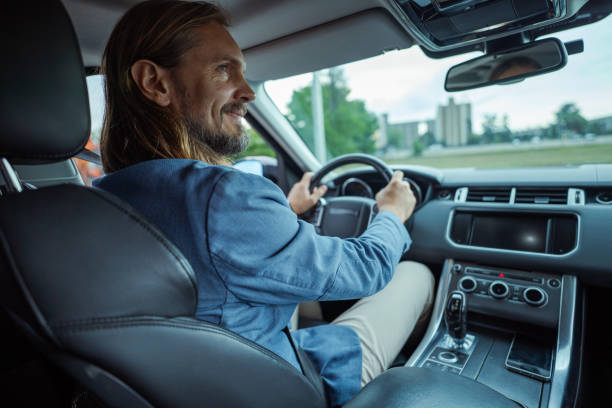 istock Handsome man driving in the city 2159699437