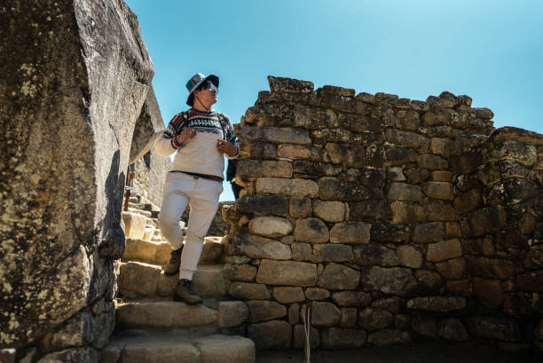 istock Mature man looking around moving down on staircase on Machu Picchu, in Peru 2159699614