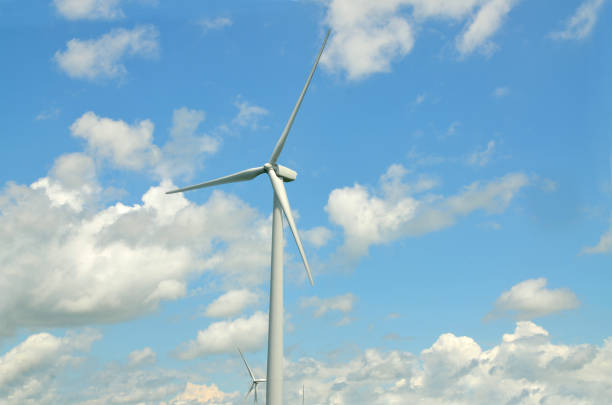 A wind turbine backlit by the afternoon Sun.