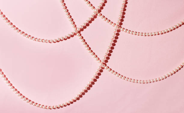 istock Abstract pale pink background, luxurious, elegant pearl strings. 2159701206