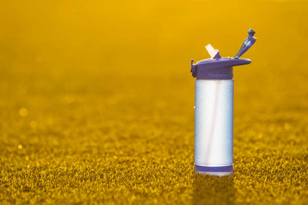 Reusable Blue Plastic Water Bottle with White Cap on Gray Background