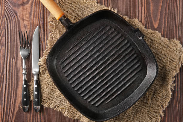 istock Cast-iron pan on wooden background 2159702185