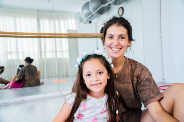 istock Portrait of a instructor and student embracing on dance studio 2159702295