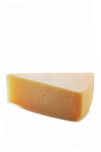 istock Triangle piece of parmesan cheese isolated on white 2159702319