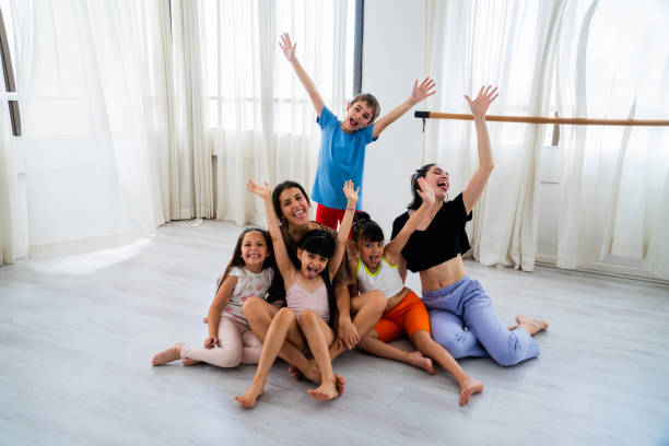 Portrait of instructor and students on dance studio