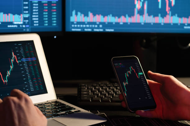 istock Cropped image of trader searching on smartphone with dynamic data. Gusher. 2159702753