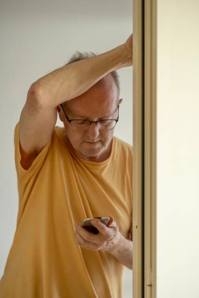 istock Adult caucasian man who has just had a cyber security or ransomware attack, showing concern, frustration and fear. 2159703504