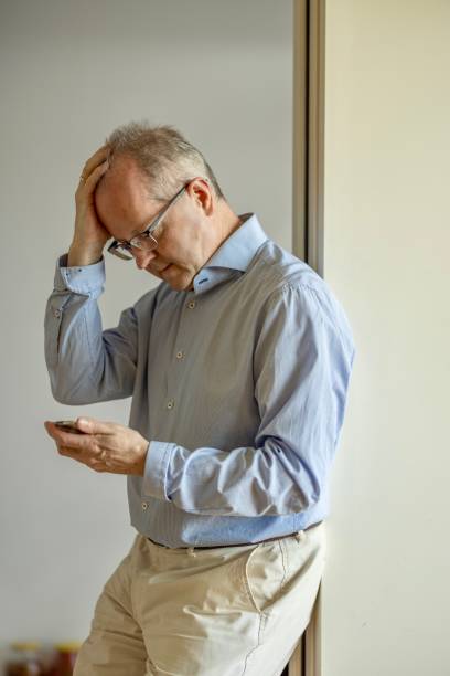 istock Adult caucasian man who has just had a cyber security or ransomware attack, showing concern, frustration and fear. 2159703634
