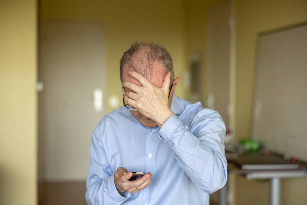 istock Adult caucasian man who has just had a cyber security or ransomware attack, showing concern, frustration and fear. 2159703662