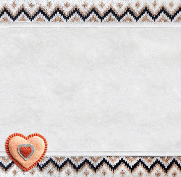 istock Vertical backdrop with suede texture, border of wool material with knitted ornament and felt heart. Background for scrapbooking with suede leather and sweater knitted texture. Copy space for text 2159704196