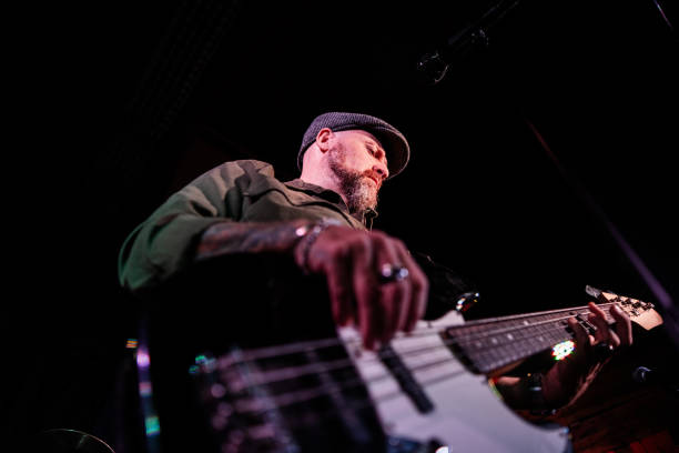 istock Mature man singing and playing guitar on a live concert 2159707364
