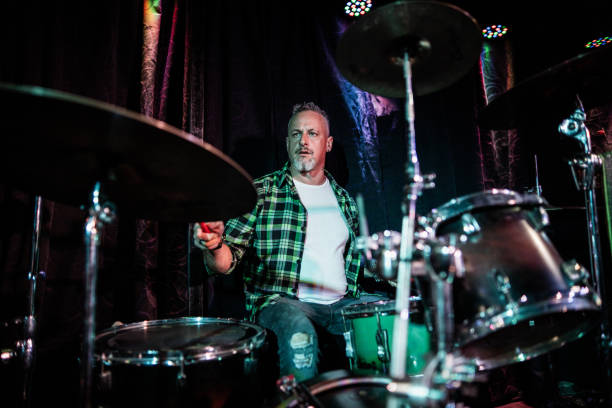 istock Mature man playing drum kit on a live concert 2159707451