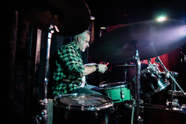 istock Mature man playing drum kit on a live concert 2159707463