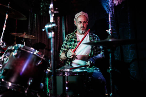 istock Mature man playing drum kit on a live concert 2159707470