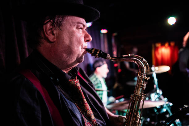 istock Senior man playing saxophone on a live concert 2159707529