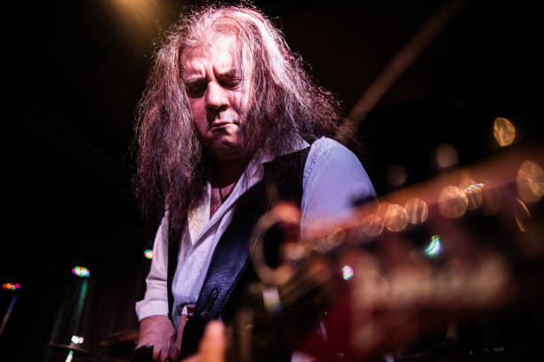 istock Mature man playing electric guitar on stage 2159707536