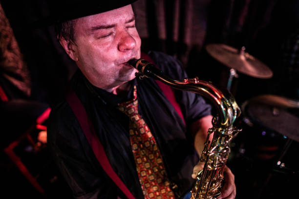 istock Senior man playing saxophone on a live concert 2159707547