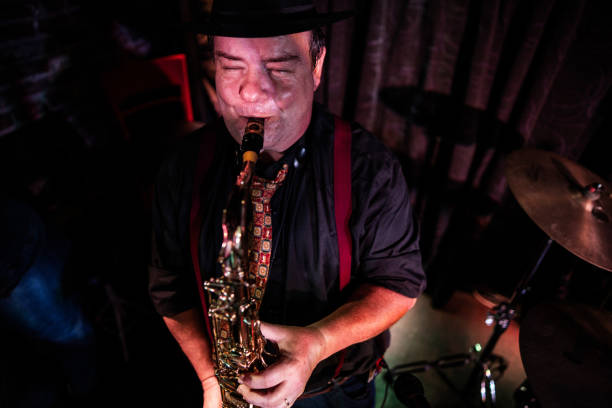 istock Senior man playing saxophone on a live concert 2159707555