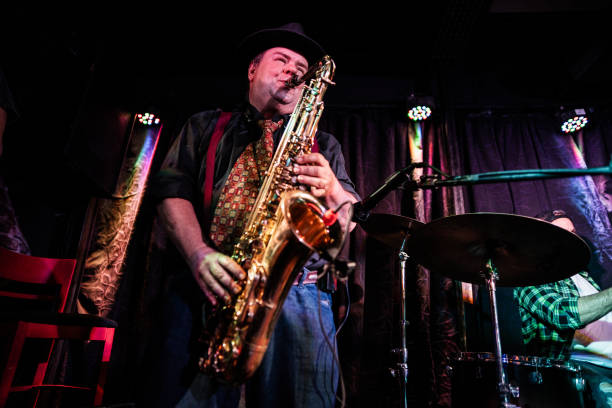 istock Senior man playing saxophone on a live concert 2159707568