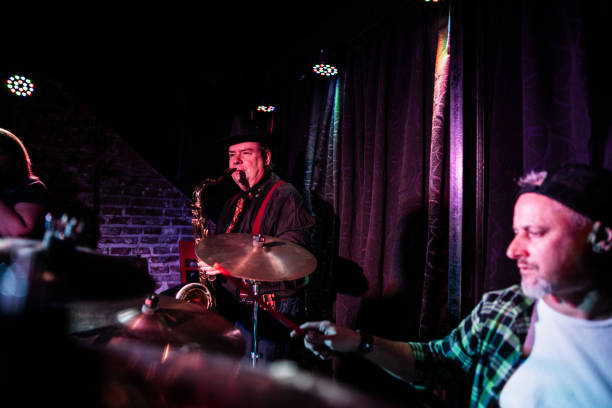 istock Senior man playing saxophone on a live concert 2159707588