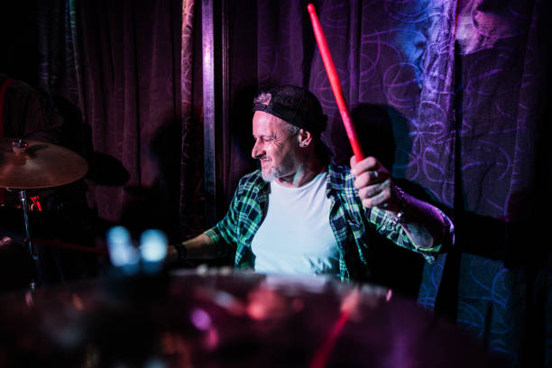 istock Mature man playing drum kit on a live concert 2159707593