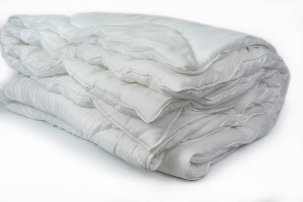 istock Folded hollowfibre Duvet. Bed summer and winter blanket 2159707607