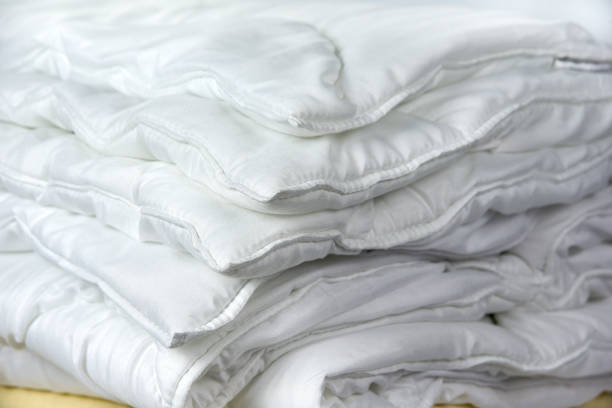 istock Folded hollowfibre Duvet. Bed summer and winter blanket 2159707684