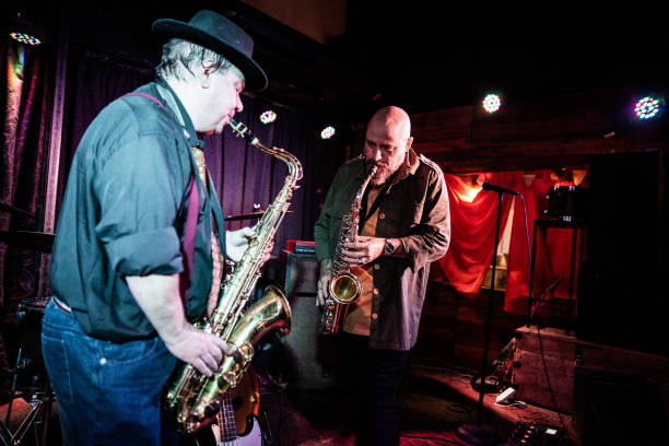 istock Musicians playing saxophone at nightclub 2159707794