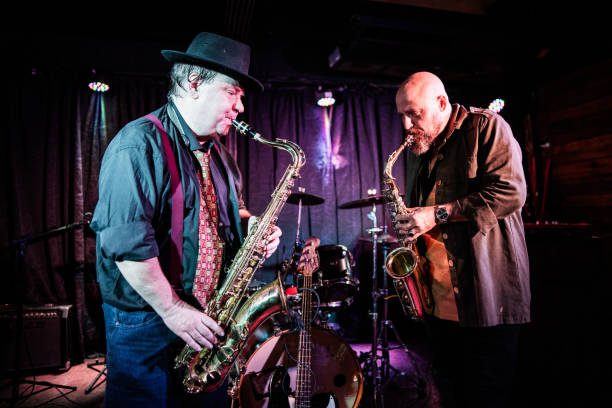 istock Musicians playing saxophone at nightclub 2159707795
