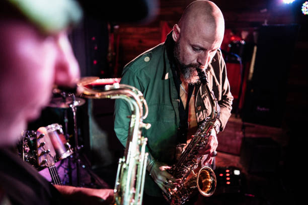istock Musicians playing saxophone at nightclub 2159707808
