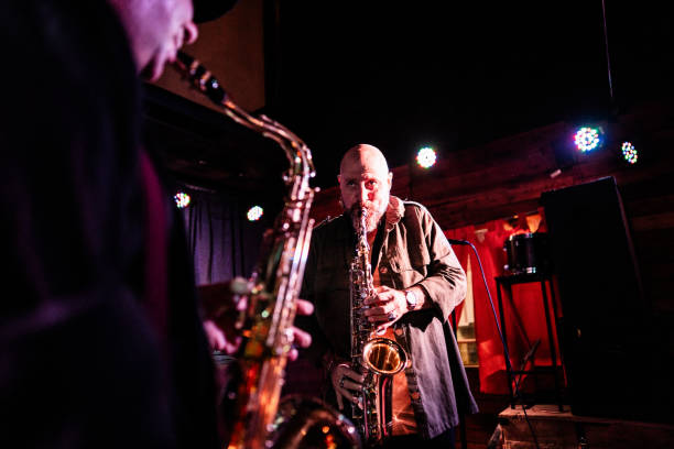 istock Musicians playing saxophone at nightclub 2159707810