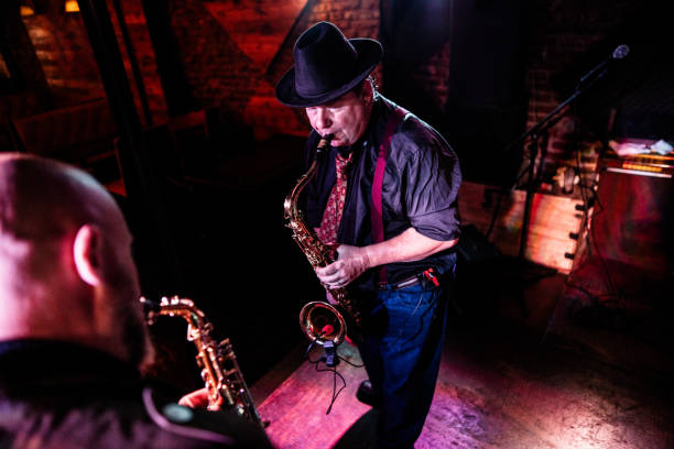 istock Musicians playing saxophone at nightclub 2159707914