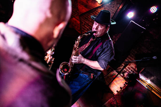 istock Musicians playing saxophone at nightclub 2159707918