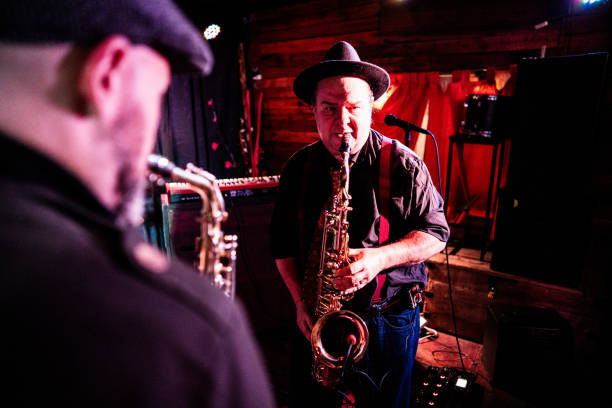 istock Musicians playing saxophone at nightclub 2159707969