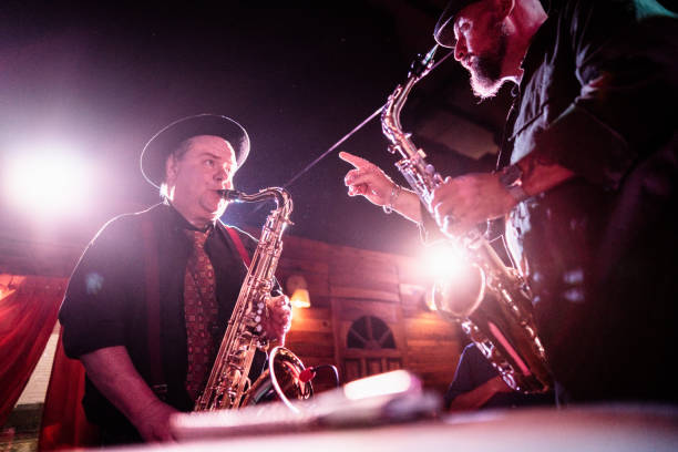 istock Musicians playing saxophone at nightclub 2159707971
