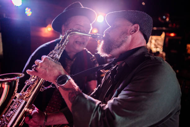 istock Musicians playing saxophone at nightclub 2159708132