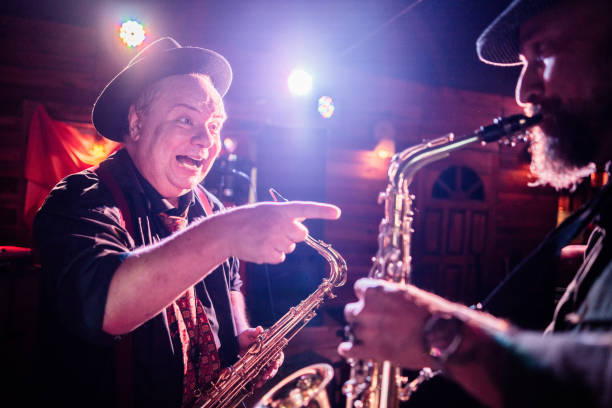 istock Musicians playing saxophone at nightclub 2159708219