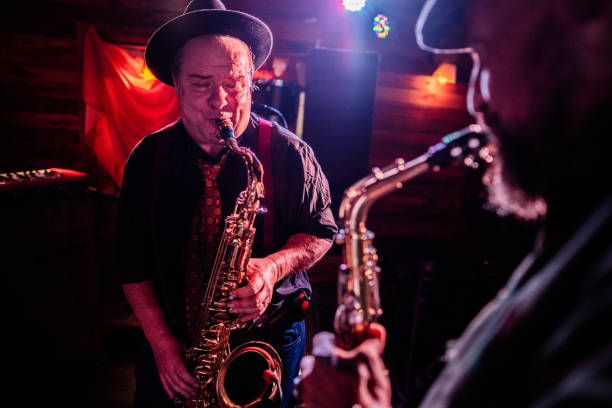 istock Musicians playing saxophone at nightclub 2159708221