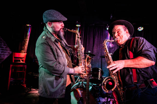 istock Musicians playing saxophone at nightclub 2159708252